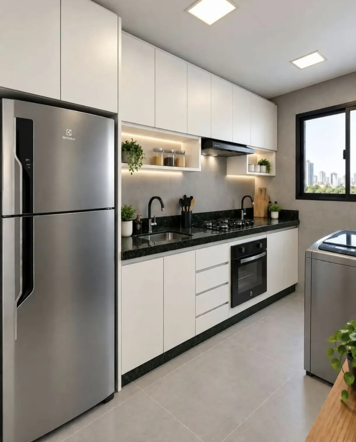Modern kitchen with white cabinets, dark countertops, a stainless steel refrigerator, an oven, and a window